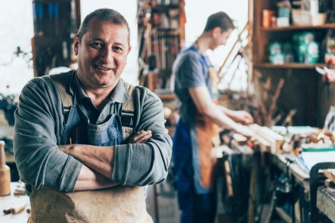 Man in workshop with employee